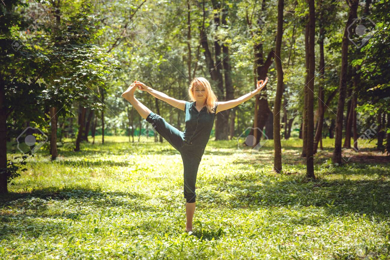 Utthita Hasta Padangustasana. Yoga asanas in nature. Yoga poses.. Utthita Hasta Padangustasana. Yoga asanas in nature. Yoga poses..