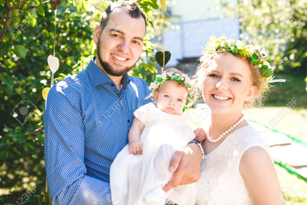 Happy Joyful Young Family With Child Father Mother And Little