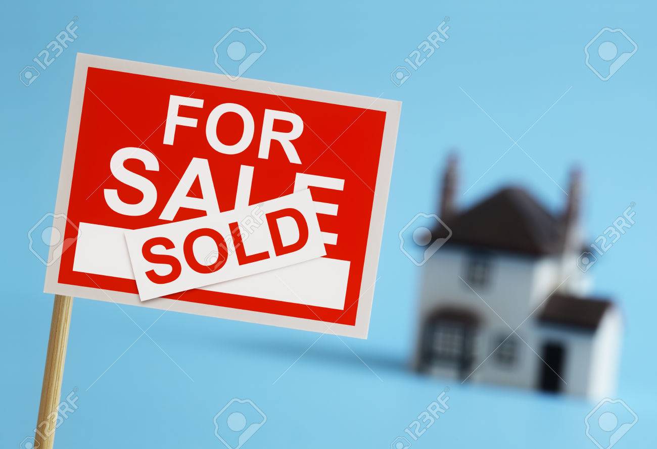 real estate agent for sale sign with sold sticker and house in for sale sign sold