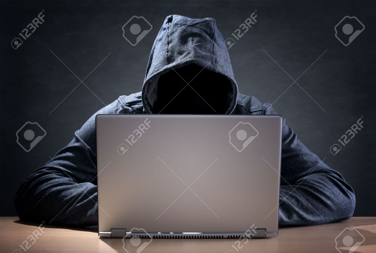 Computer Hacker Stealing Data From A Laptop Concept For Network