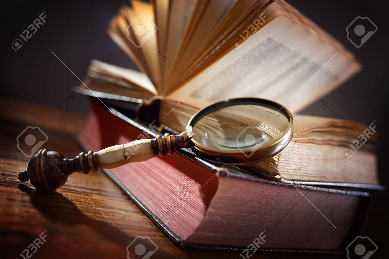 Book and magnifying glass concept for education, knowledge and searching for information - 54427923 Book and magnifying glass concept for education, knowledge and searching for information - 54427923