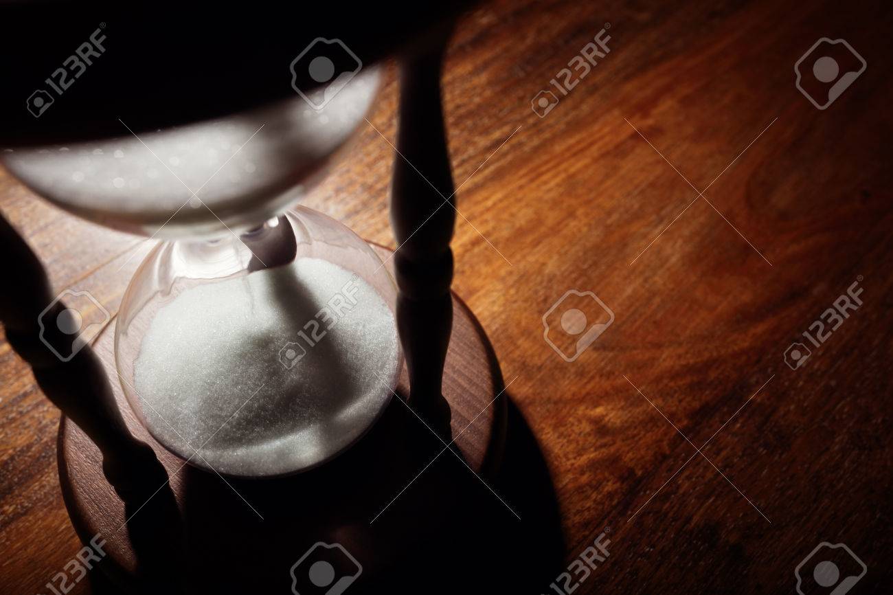 Hourglass time passing concept for business deadline, urgency and running out of time - 54428266 Hourglass time passing concept for business deadline, urgency and running out of time - 54428266