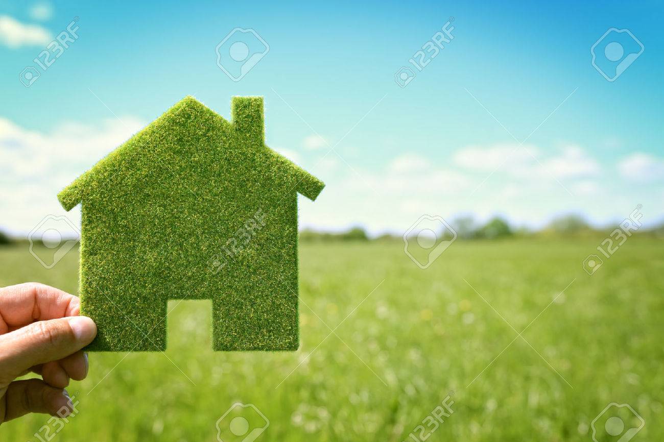 Green eco house environmental background in field for future residential building plot - 61386069 Green eco house environmental background in field for future residential building plot - 61386069
