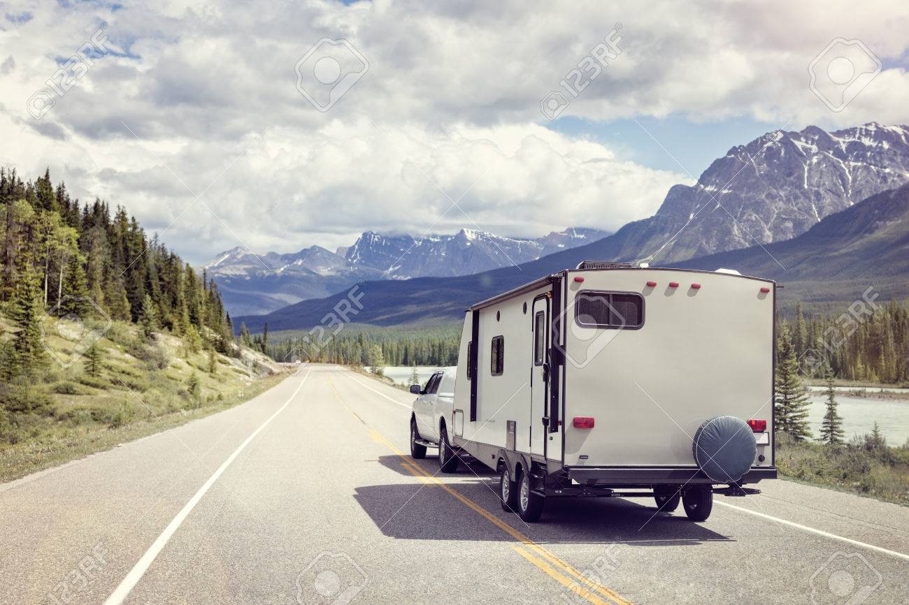 Caravan or recreational vehicle motor home trailer on a mountain road in Canada - 66000336 Caravan or recreational vehicle motor home trailer on a mountain road in Canada - 66000336