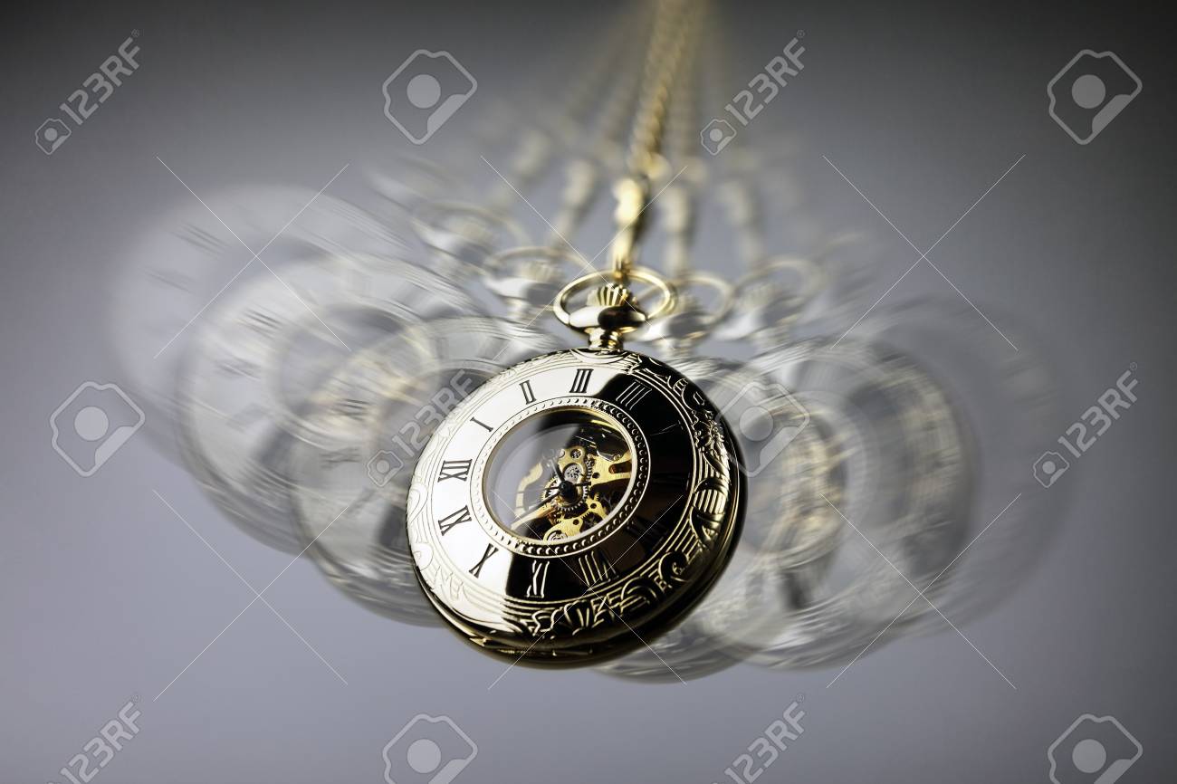 Hypnotism concept, gold pocket watch swinging used in hypnosis treatment - 93011526 Hypnotism concept, gold pocket watch swinging used in hypnosis treatment - 93011526
