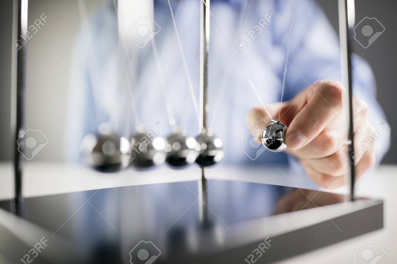 Newton's cradle businessman releasing ball concept for cause and effect - 93011528 Newton's cradle businessman releasing ball concept for cause and effect - 93011528