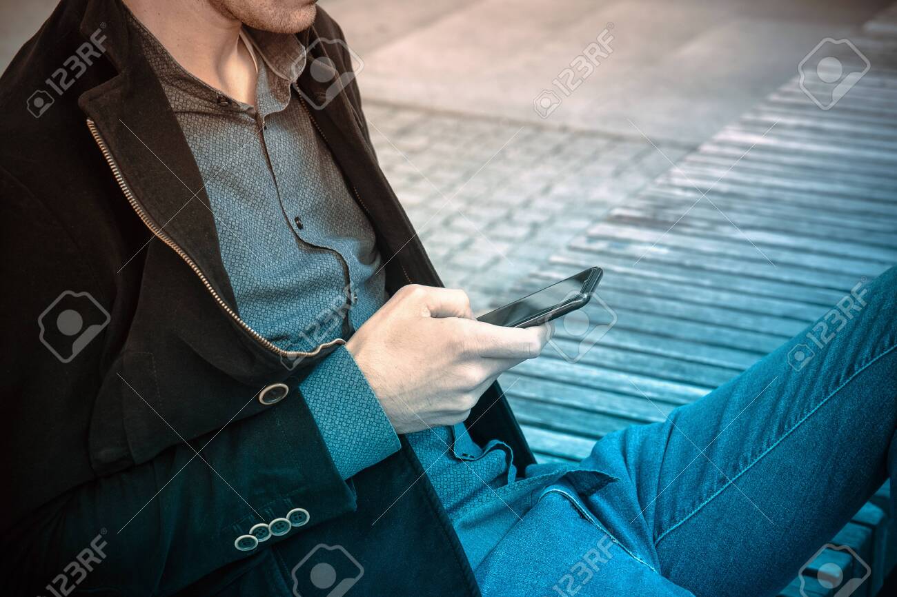 black coat and blue jeans