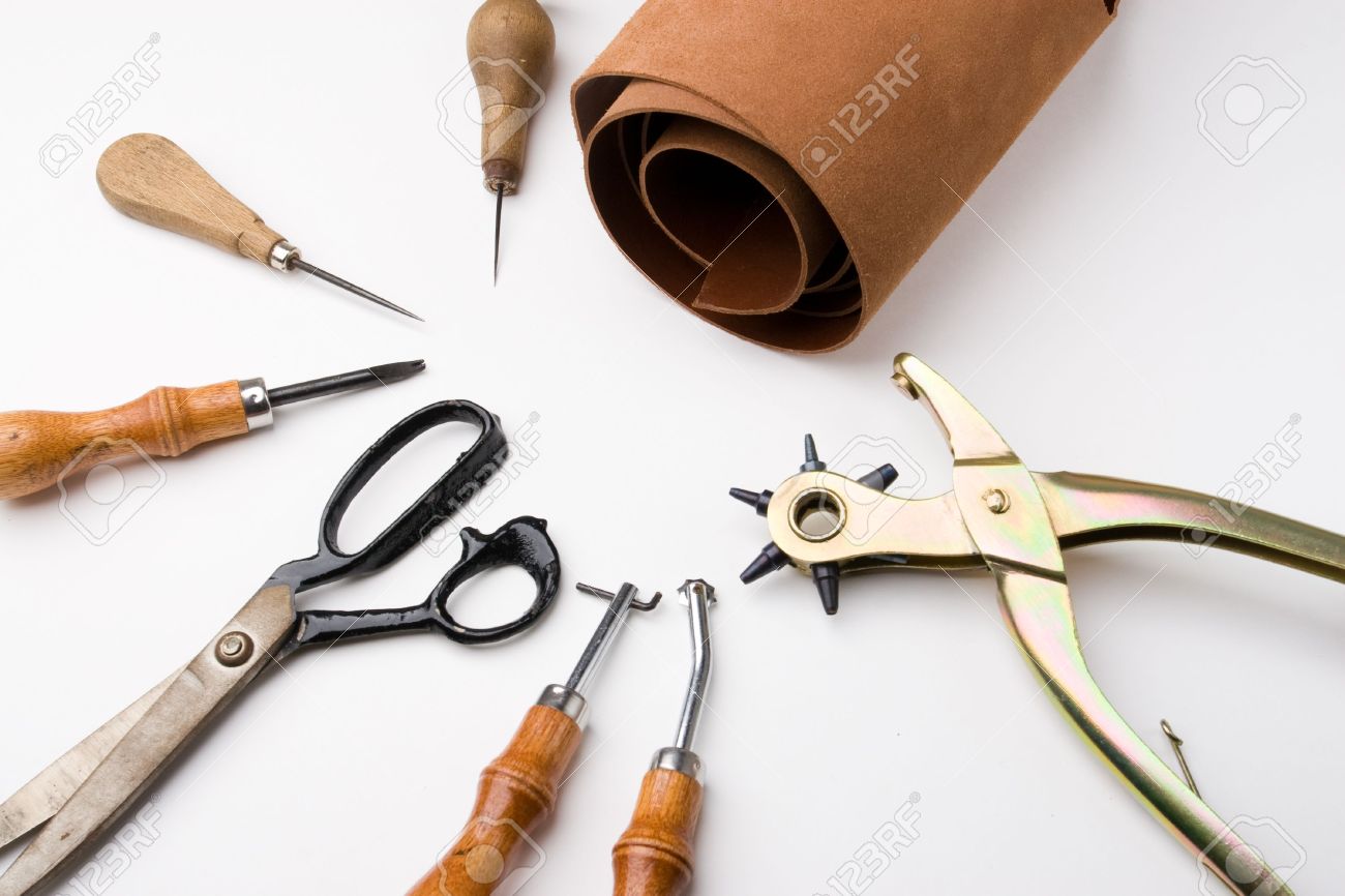Some tools to work leather over leather background - 1797981 Some tools to work leather over leather background - 1797981