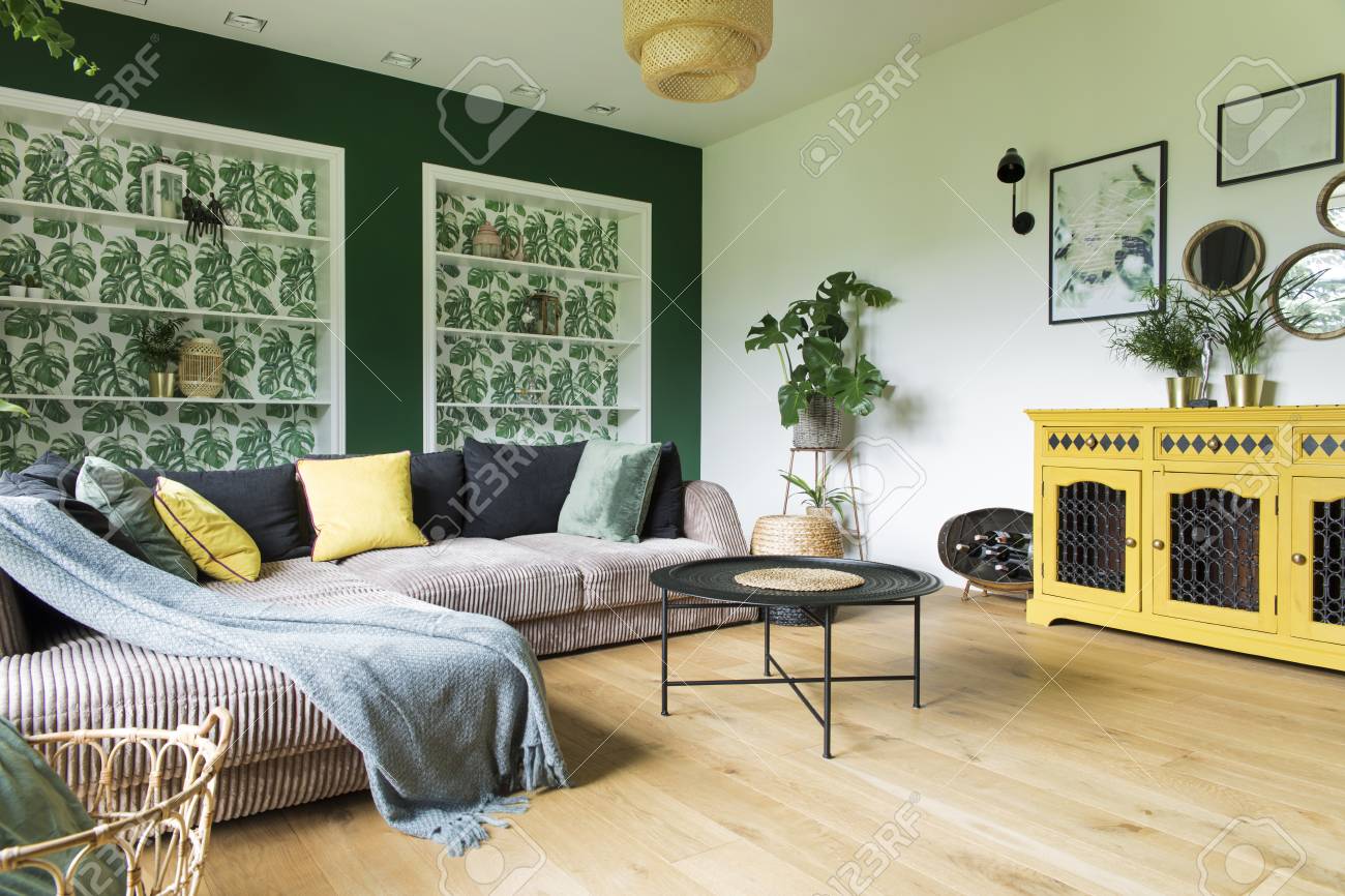 Stylish And Modern Interior With Sofa Colors Pillows Flowers