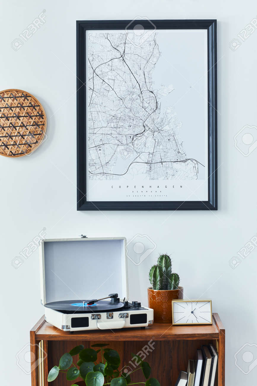 Stylish scandinavian living room interior with retro commode, black mock up poster frame, clock, cacti decoration, book and personal accessoreis in home decor. Template - 168356730 Stylish scandinavian living room interior with retro commode, black mock up poster frame, clock, cacti decoration, book and personal accessoreis in home decor. Template - 168356730
