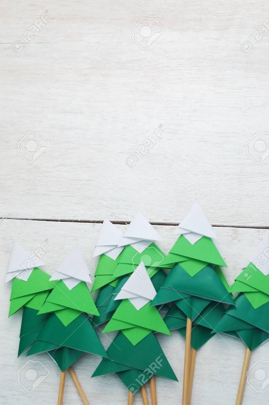 Handmade Origami Paper Craft Christmas Tree On White Wooden Background