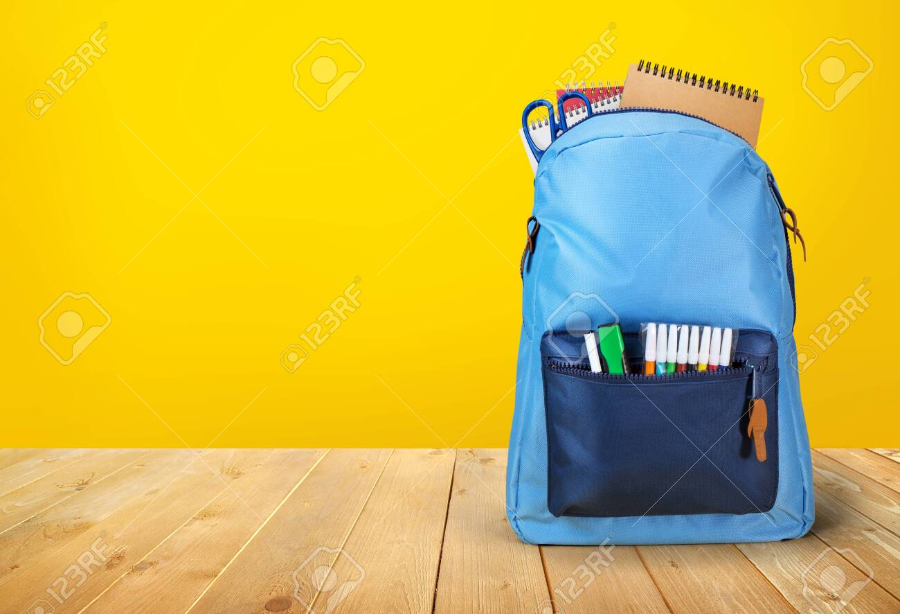 School Bag Backpack With Notebooks On Wodden Table Stock Photo