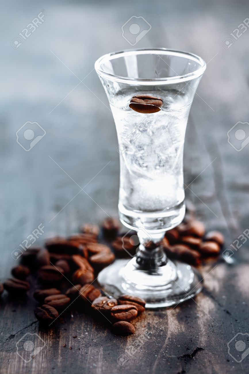 Ster Radioactief Baleinwalvis Tall Glass With Clear Sambuca And Coffee Beans Spilled Around The Base Of  The Glass Stock Photo, Picture And Royalty Free Image. Image 13060775.