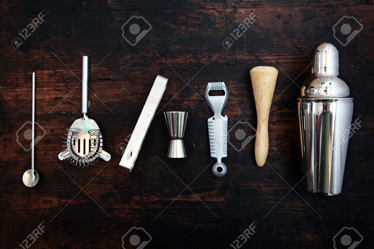 set of bar or pub accessories with a martini cocktail shaker stock