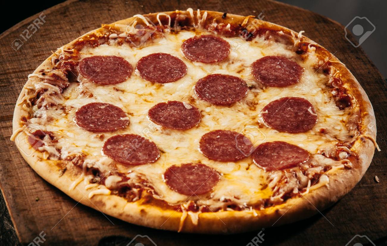 Appetizing Italian Pepperoni Pizza With Sliced Spicy Salami Sausage Stock Photo Picture And Royalty Free Image Image