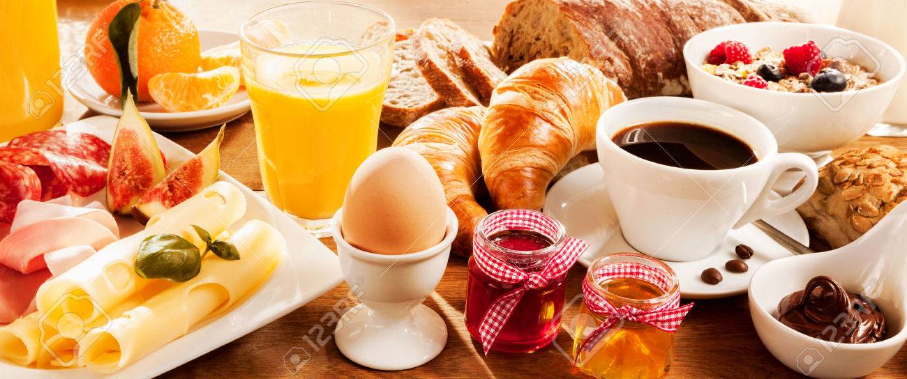 Breakfast feast with egg, meat, bread, coffee and juice - 51721166 Breakfast feast with egg, meat, bread, coffee and juice - 51721166