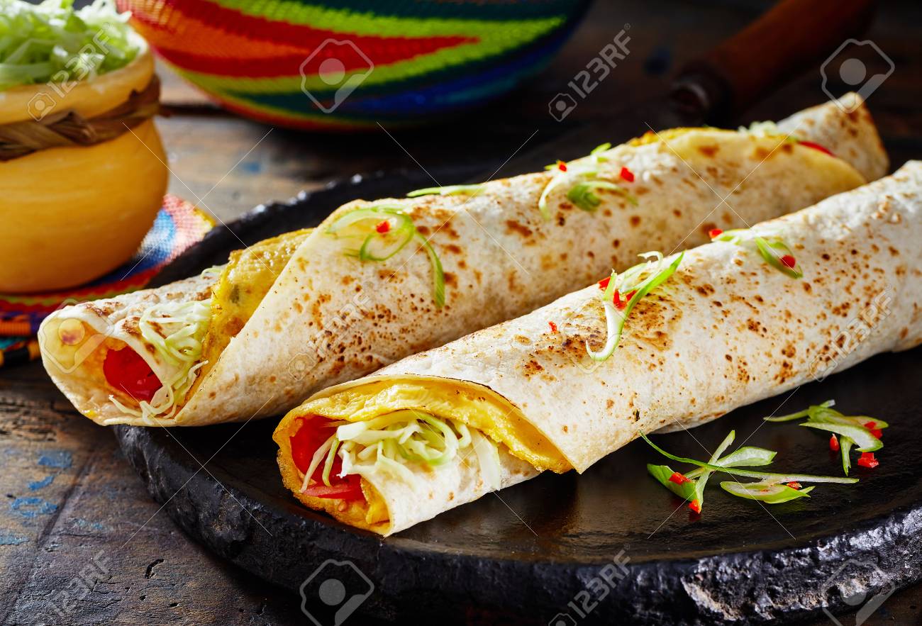 Popular African street food with traditional Rolex Rolls made..