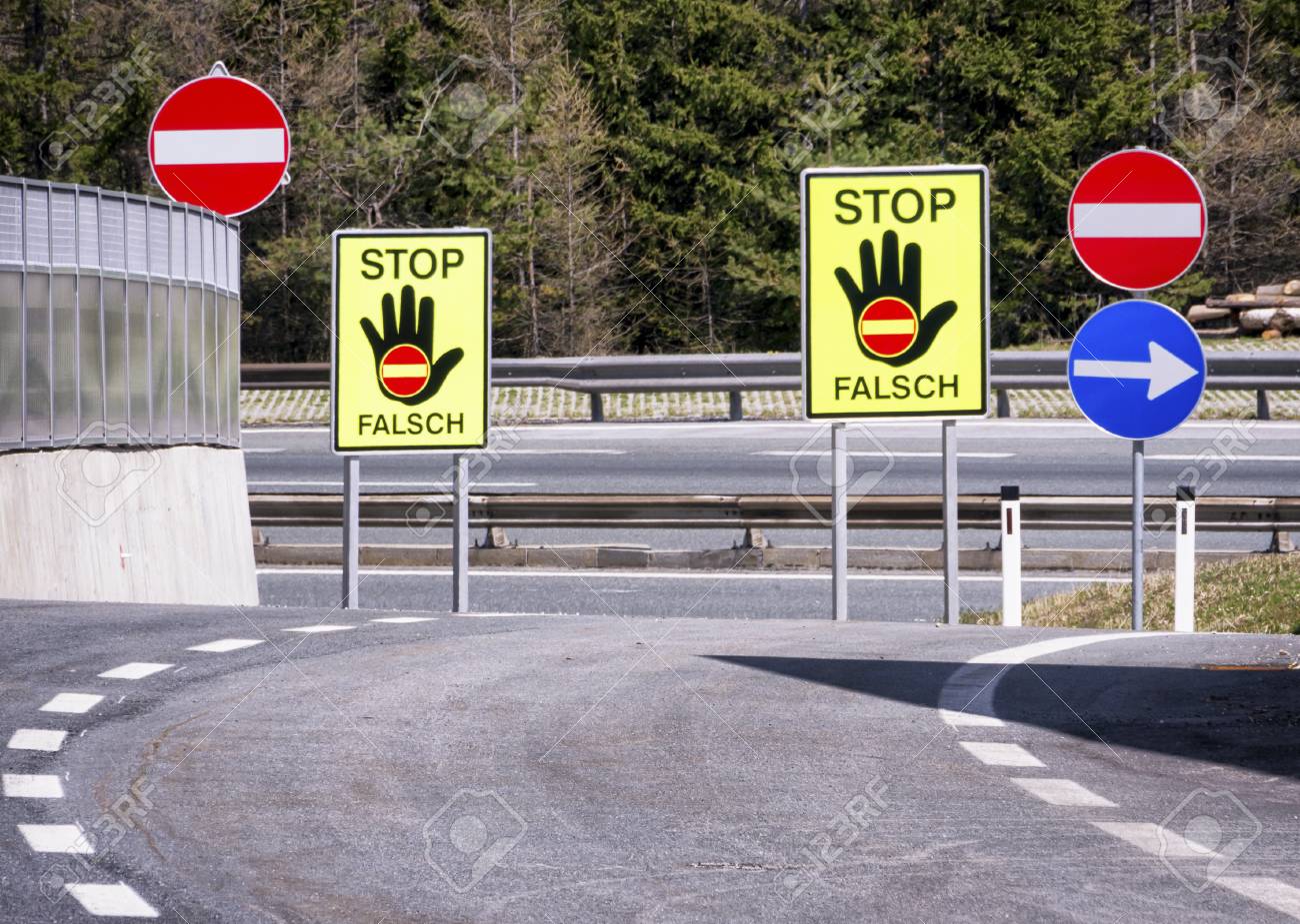 25162797-stop-signs-wrong-way-in-austria-at-a-highway.jpg