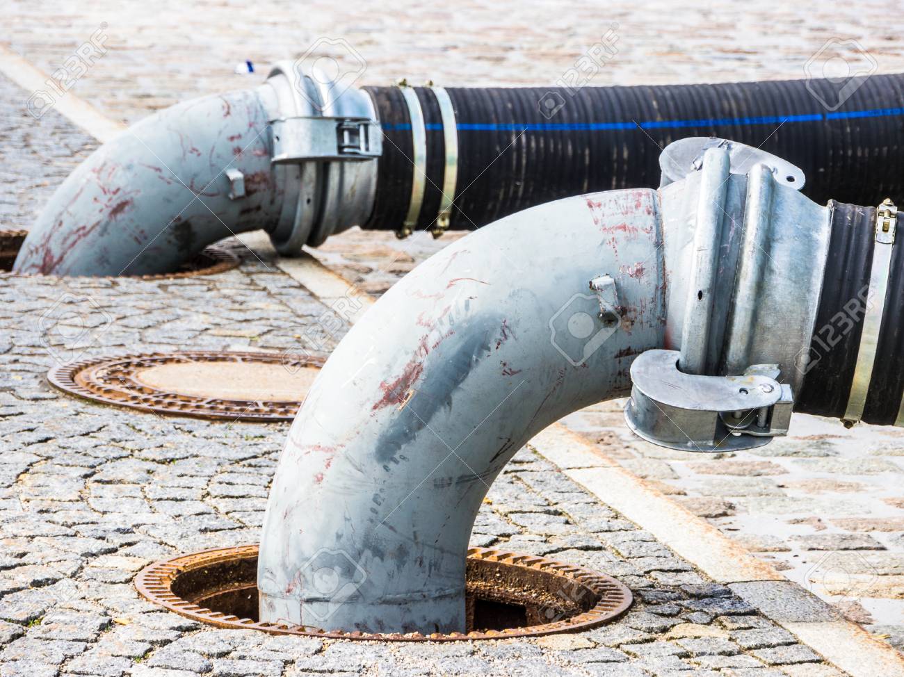 tubes at a sidewalk - photo - closeup - 81216199 tubes at a sidewalk - photo - closeup - 81216199