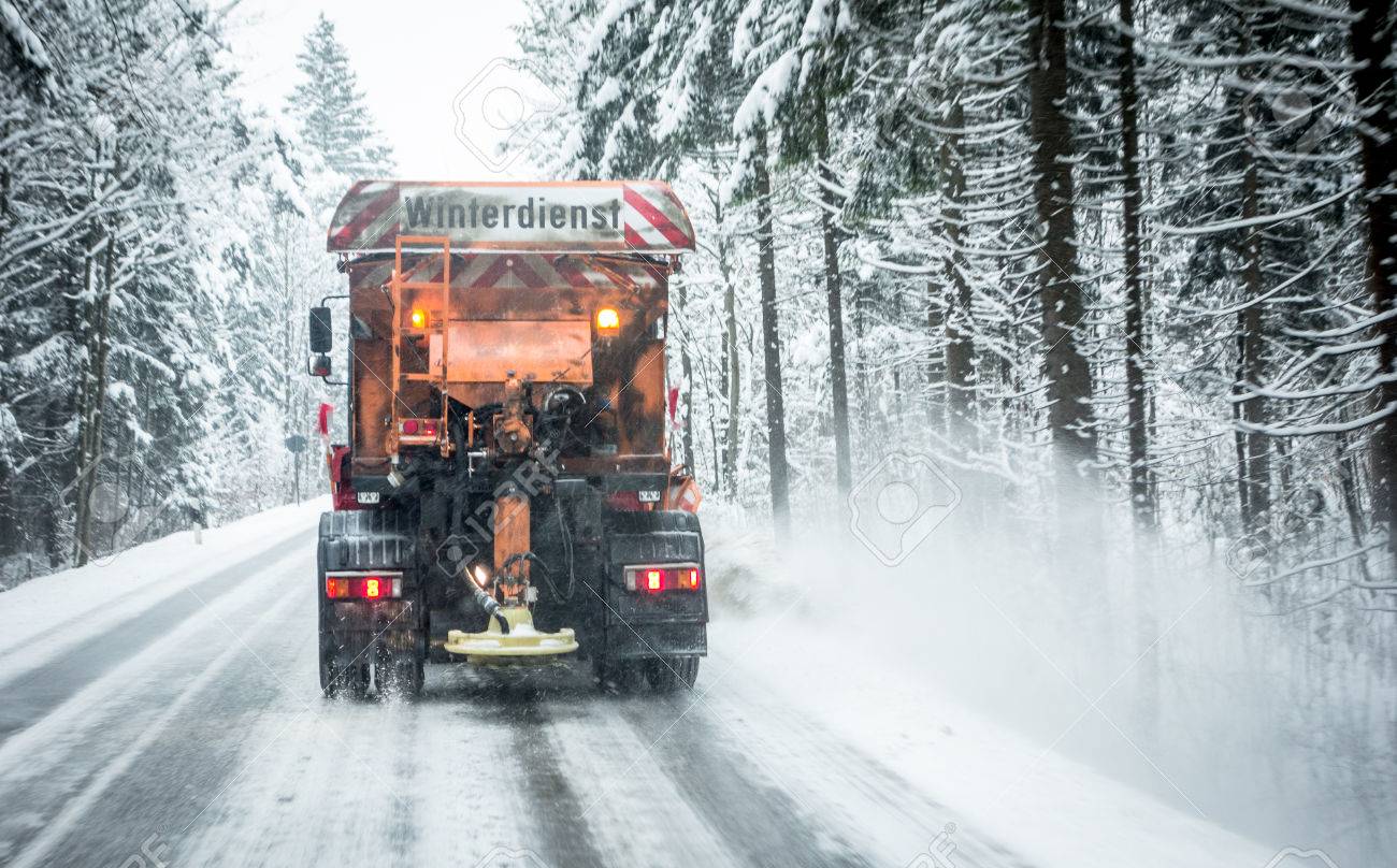 snowplow in winter - austria - europe - german word: winterdienst - 81613101 snowplow in winter - austria - europe - german word: winterdienst - 81613101