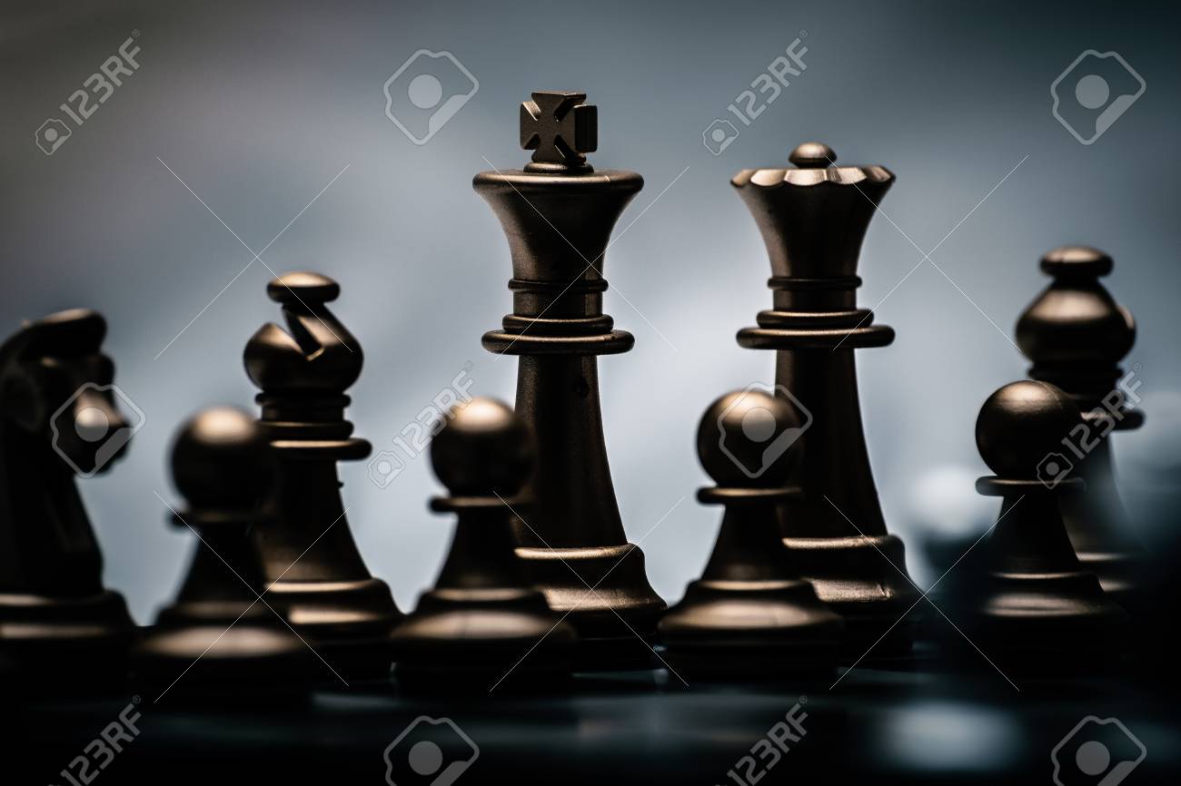 chess pieces in different combinations on a black and white board