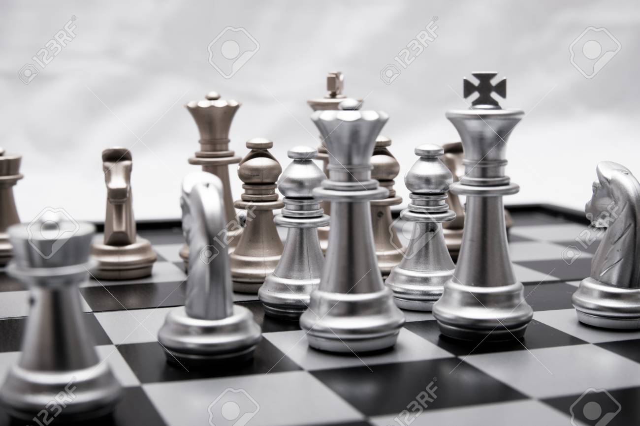 chess pieces in different combinations on a black and white board