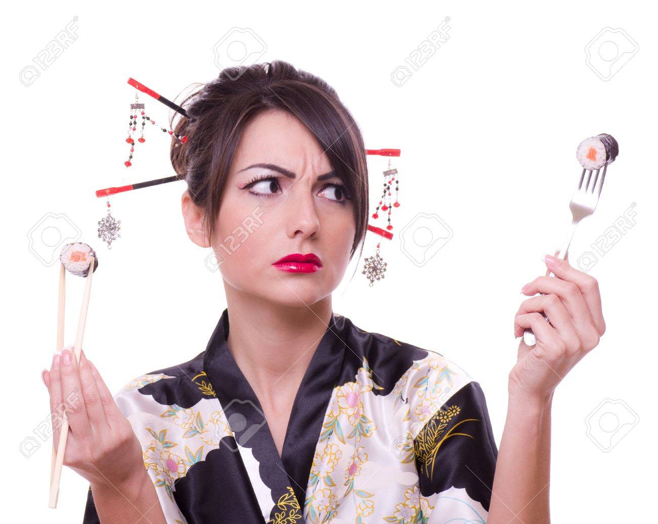 Young woman in Japanese kimono with chopsticks, fork and sushi roll, isolated on white background. - 12172364 Young woman in Japanese kimono with chopsticks, fork and sushi roll, isolated on white background. - 12172364
