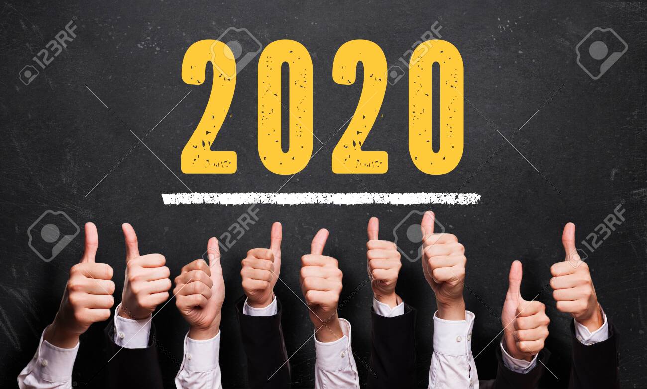 many thumbs up in front of blackboard with message 2020 - 133767904 many thumbs up in front of blackboard with message 2020 - 133767904