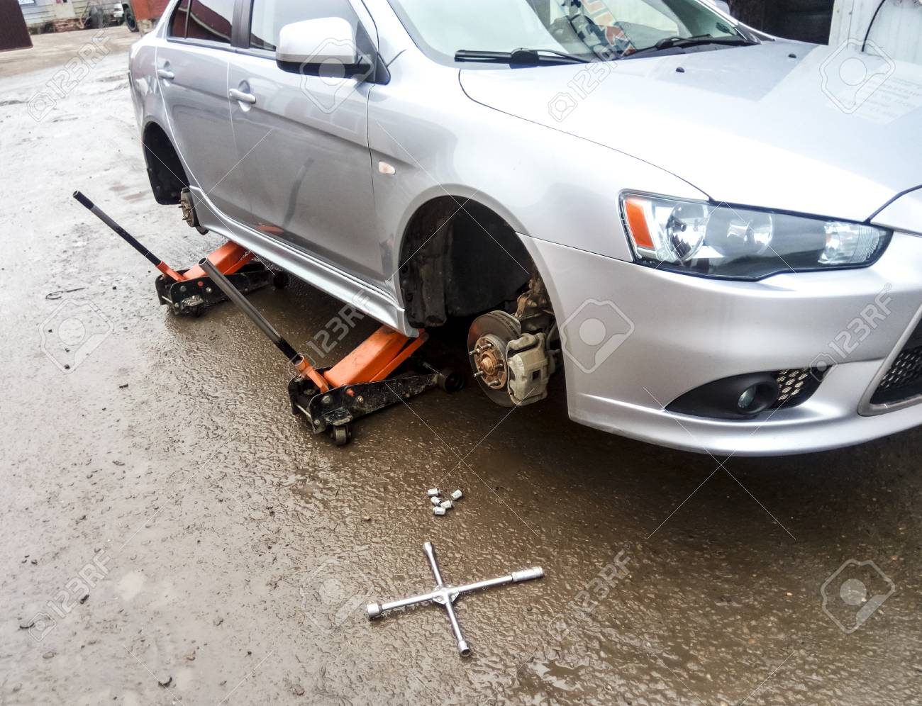 Car Care Center >> The Car Is At The Tire Shop Under The Jack The Car In Car Care Car Care Center >> The Car Is At The Tire Shop Under The Jack The Car In Car Care