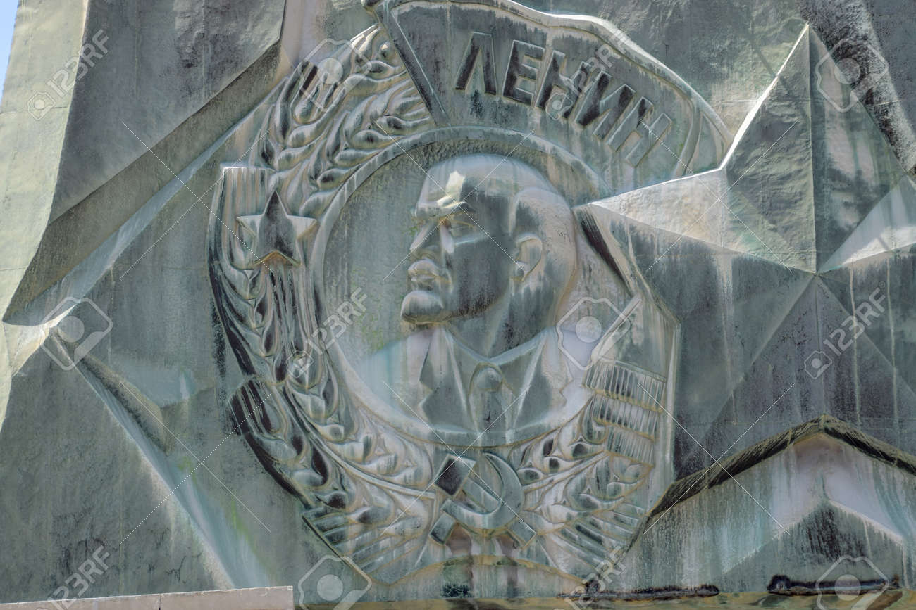 Novorossiysk, Russia - May 20, 2018: Coat of arms with a bas-relief of Lenin on the monument. The leader of the revolution. - 133522193 Novorossiysk, Russia - May 20, 2018: Coat of arms with a bas-relief of Lenin on the monument. The leader of the revolution. - 133522193