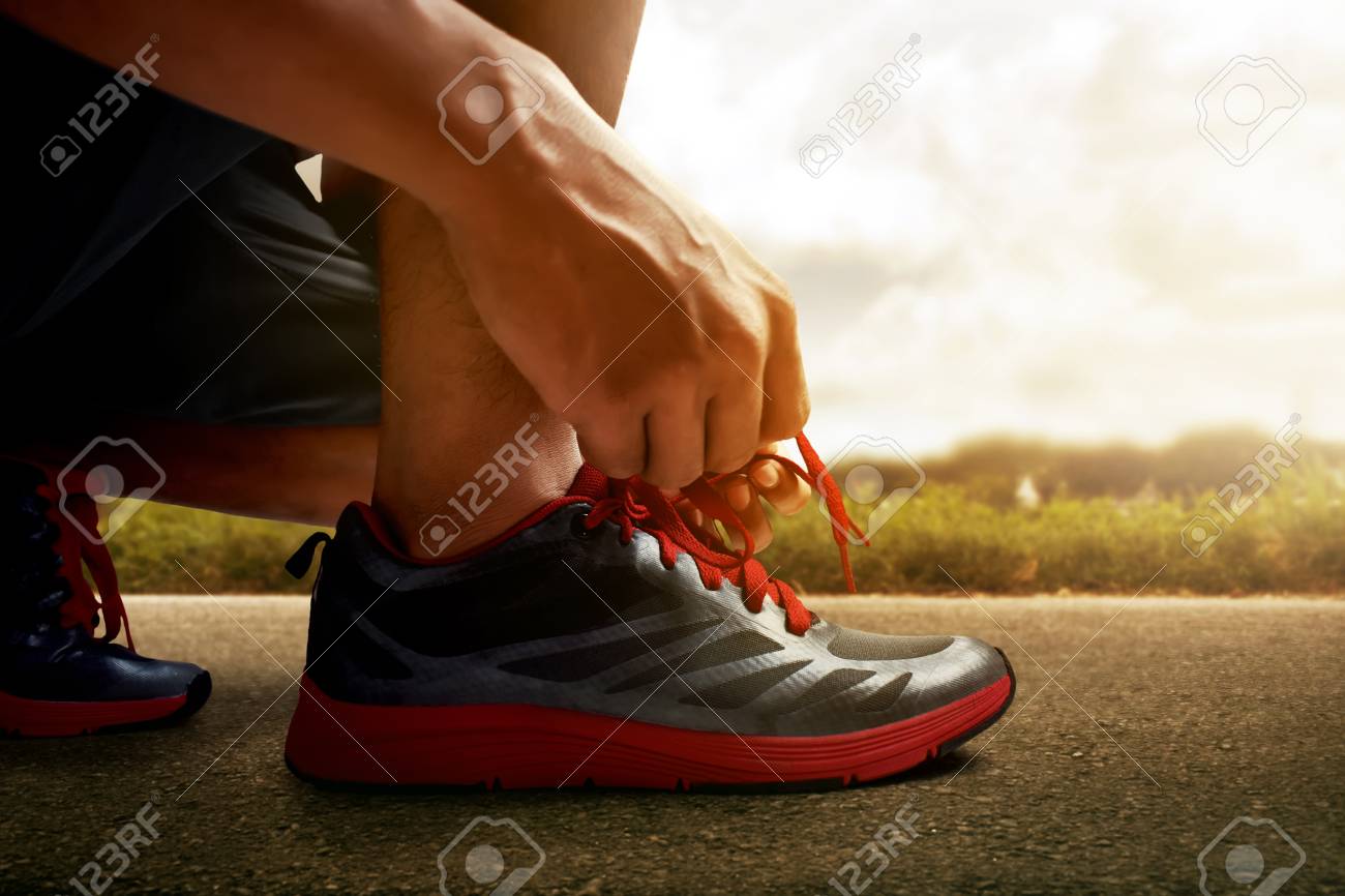 tying running shoes