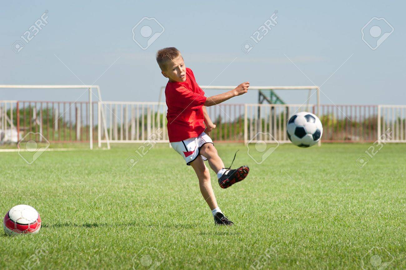 little boy kicking at