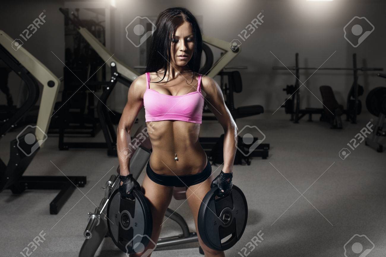 Sexy Fitness Woman In Sport Wear With Perfect Fitness Body In Gym Performing Back Exercises With Sexy Fitness Woman In Sport Wear With Perfect Fitness Body In Gym Performing Back Exercises With