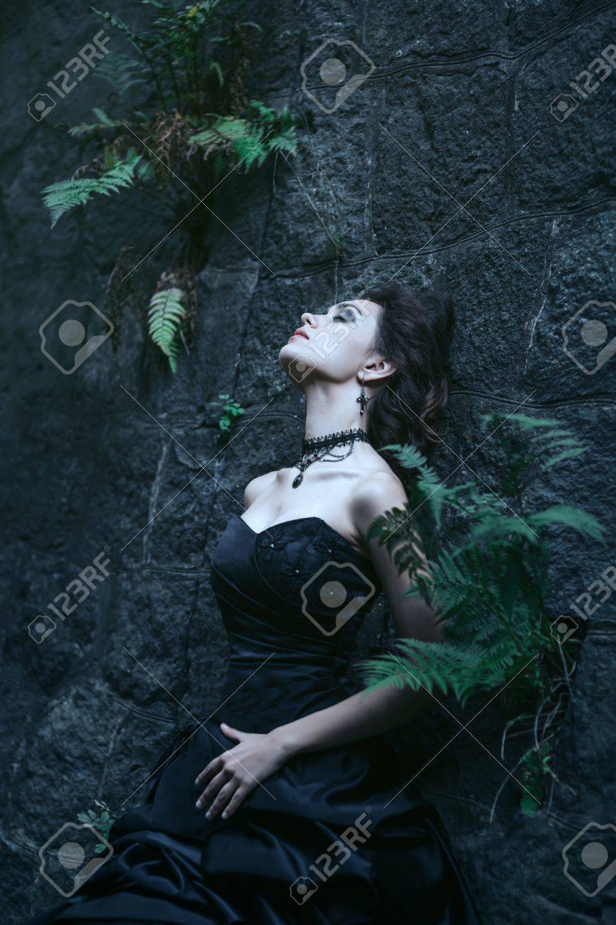 Shoot of sad brunette over the ancient building background - 54746852 Shoot of sad brunette over the ancient building background - 54746852