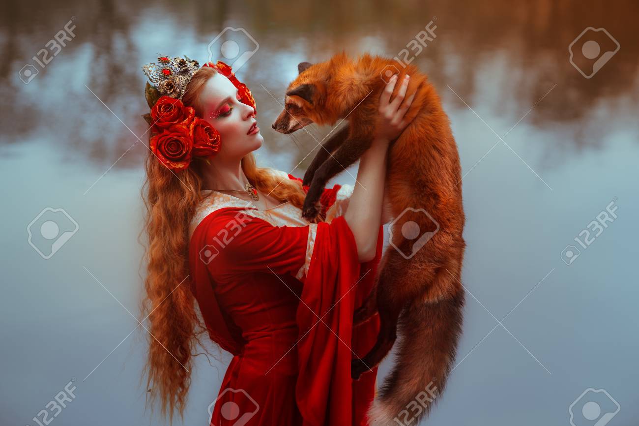 キツネと中世の赤いドレスを着た若い女性 の写真素材 画像素材 Image キツネと中世の赤いドレスを着た若い女性 の写真素材 画像素材 Image