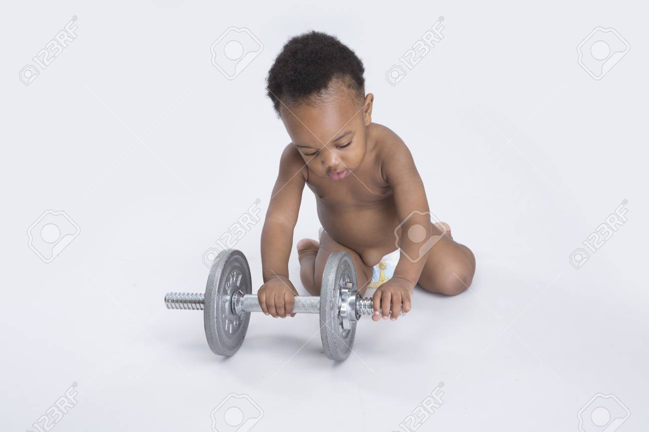 baby with dumbbell