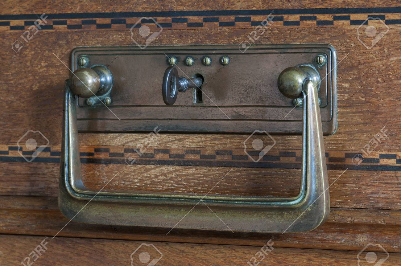 Security On An Old Cabinet, Key In The Door Lock. Stock Photo Security on an old cabinet, key in the door lock. Stock Photo - 36671135 - Security On An Old Cabinet, Key In The Door Lock. Stock Photo