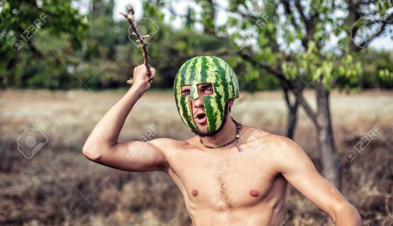 22283860-photo-of-the-young-soldier-with-a-water-melon-on-a-head-Stock-Photo.jpg
