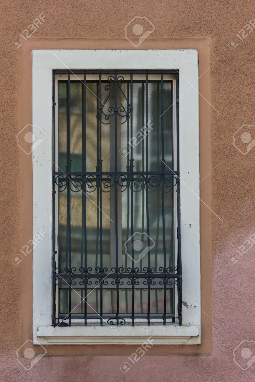 Window grill windows with iron bars stock photo
