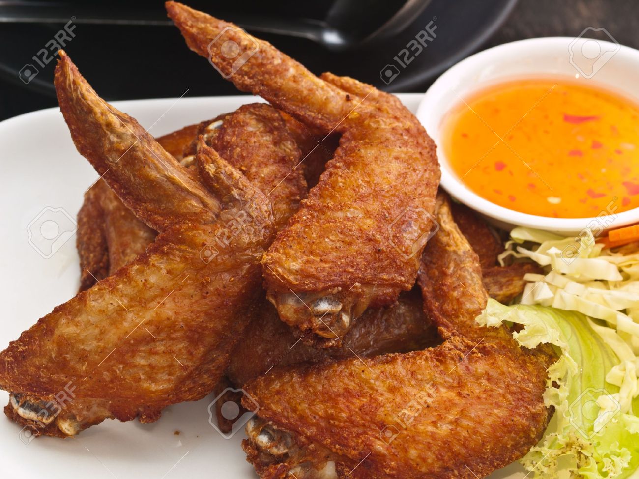 9213591-Fried-Chicken-wing-on-plate-Stoc
