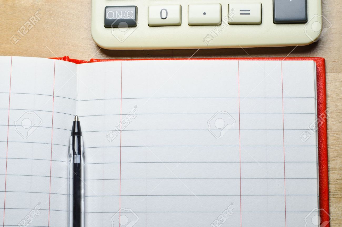 a calculator and an open two column cash book with pen on a stock