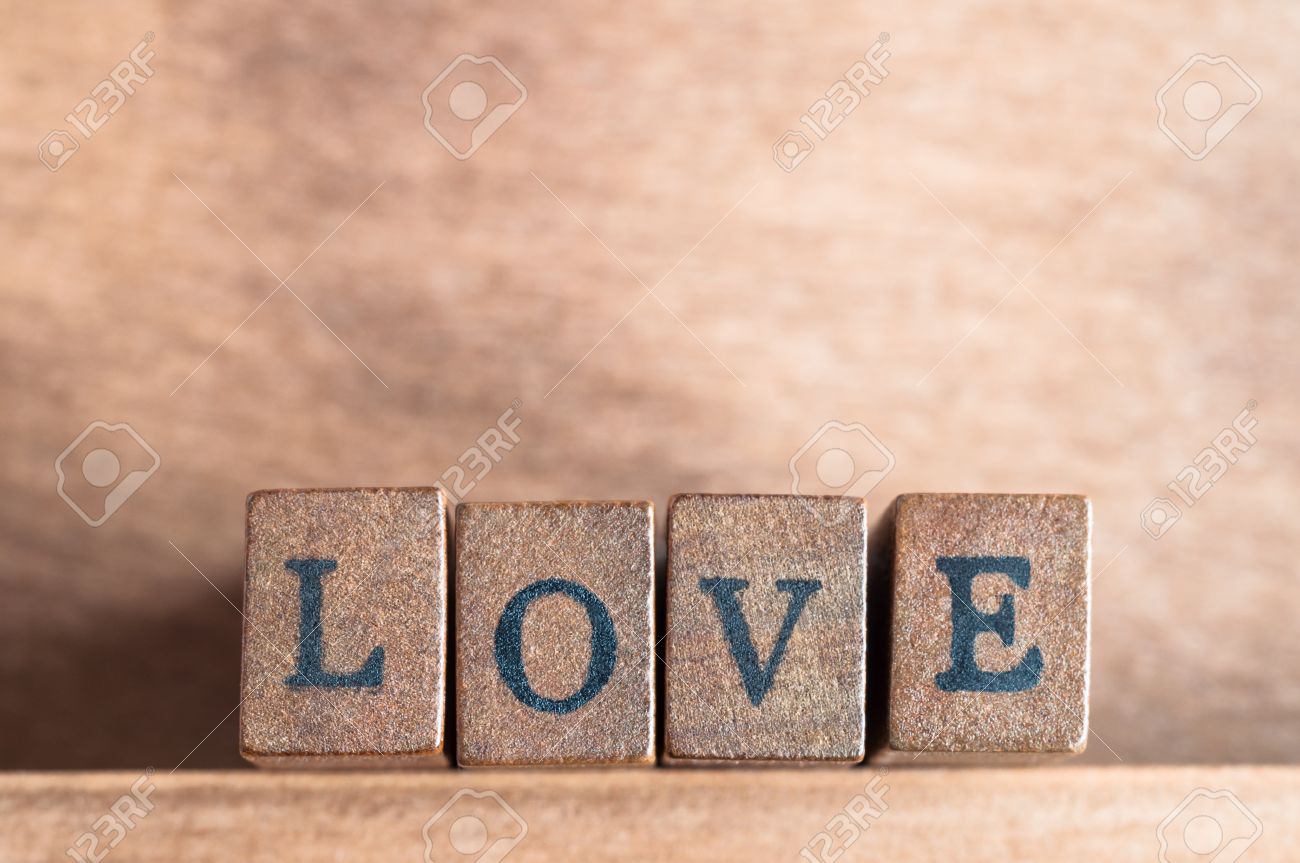 Stock Photo The Word Love Spelled Out On A Row Of Lettered Wooden Blocks With Retro Or Vintage Appearance Facing Forward On A Wooden Shelf With Wood Stock Photo The Word Love Spelled Out On A Row Of Lettered Wooden Blocks With Retro Or Vintage Appearance Facing Forward On A Wooden Shelf With Wood