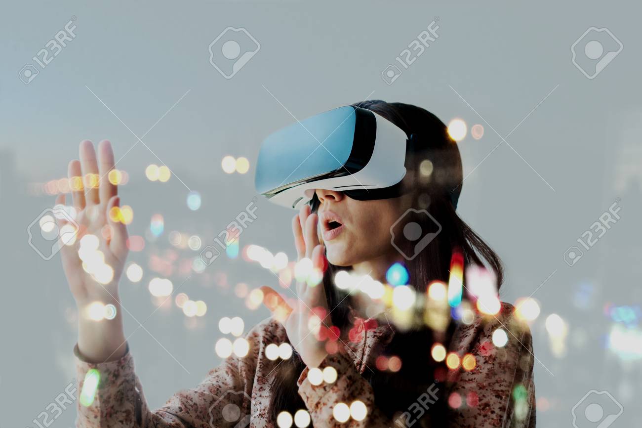 The woman with glasses of virtual reality. Future technology concept. Modern imaging technology. - 96914711 The woman with glasses of virtual reality. Future technology concept. Modern imaging technology. - 96914711