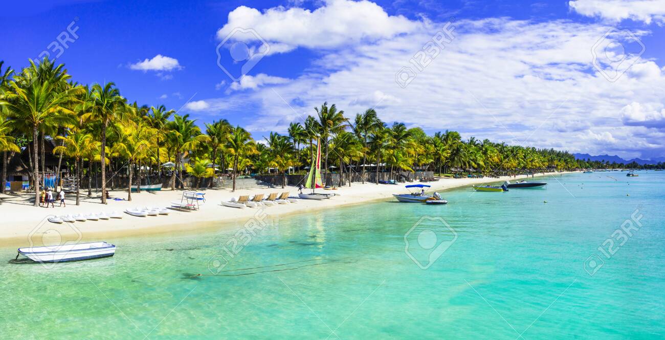 Turquoise sea and palm trees in Mauritius island - 124505238 Turquoise sea and palm trees in Mauritius island - 124505238