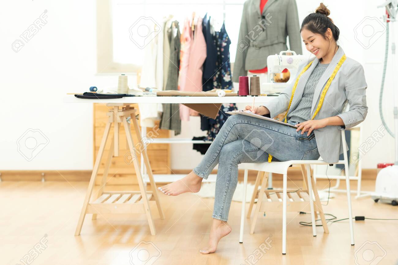 Asian Young Women Fashion Designer Working On Her Designer In The Showroom,  Lifestyle Stylish Tailor Taking Measurements On Mannequin In Studio.  Business Small Concept Stock Photo, Picture And Royalty Free Image. Image