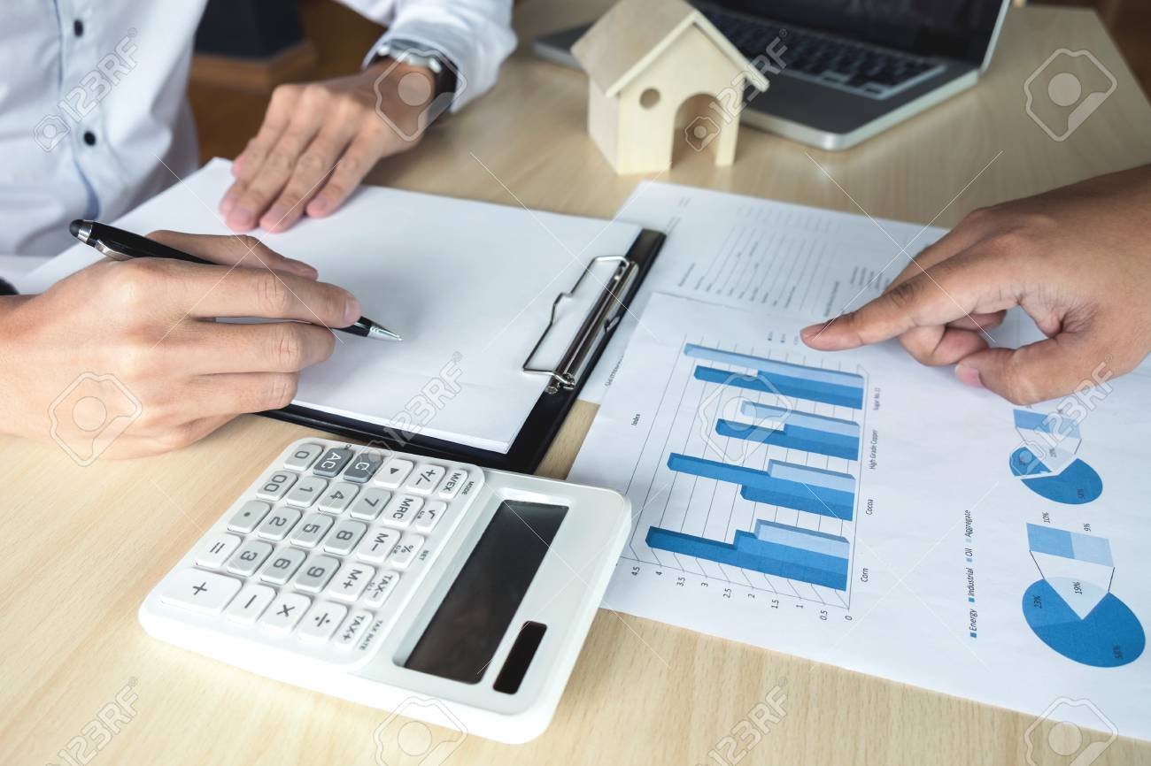 man sign a home insurance policy on home loans agent holds loan