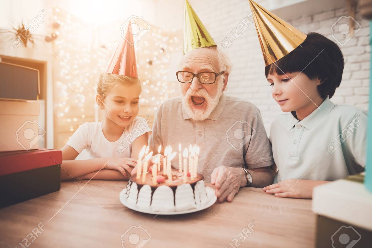 Download Grandfather Grandson And Granddaughter At Table At Home Grandpa Stock Photo Picture And Royalty Free Image Image 98600579