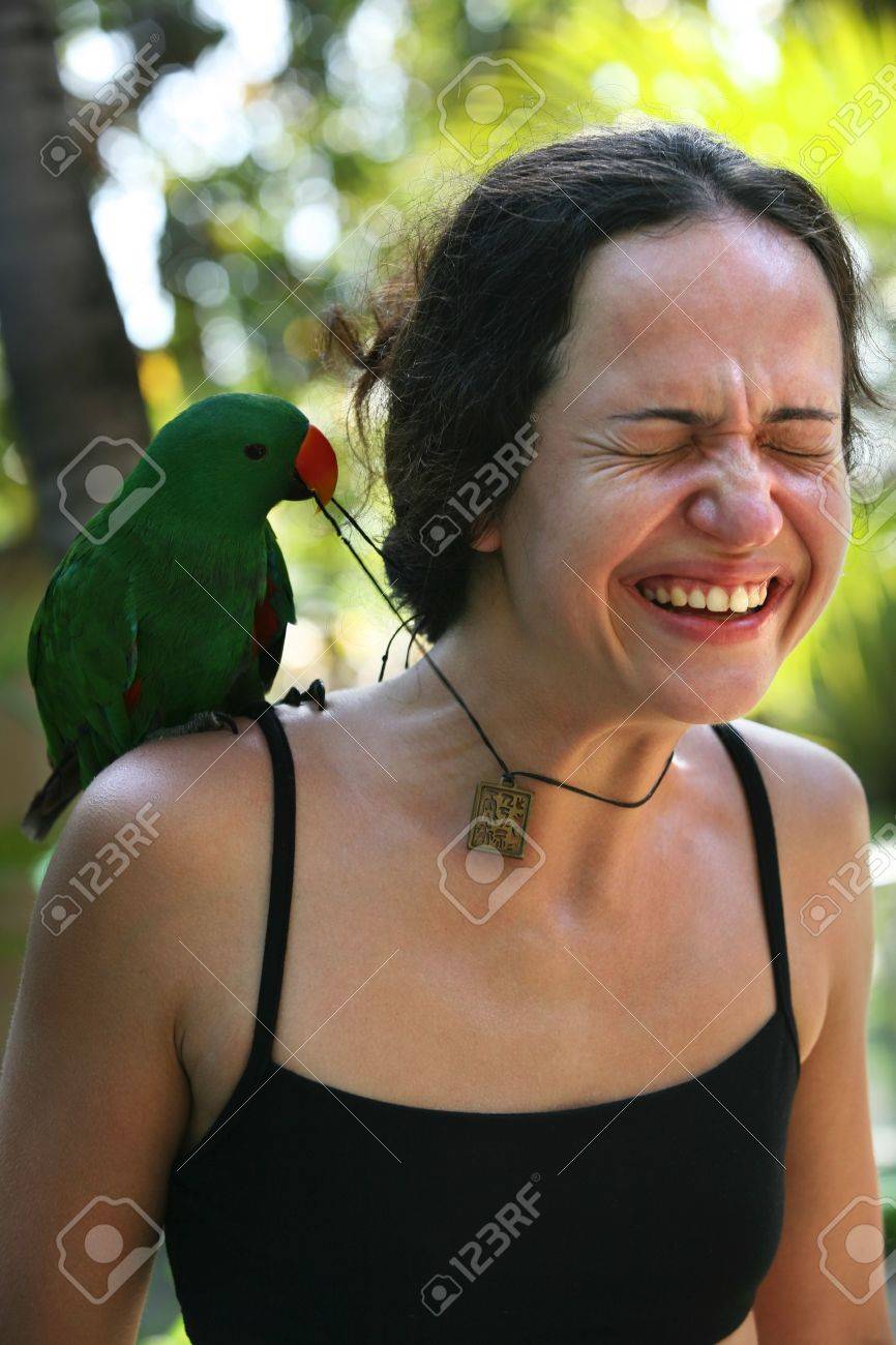 3475033-The-girl-with-a-green-parrot-on-a-shoulder-Bali-Indonesia-Stock-Photo.jpg
