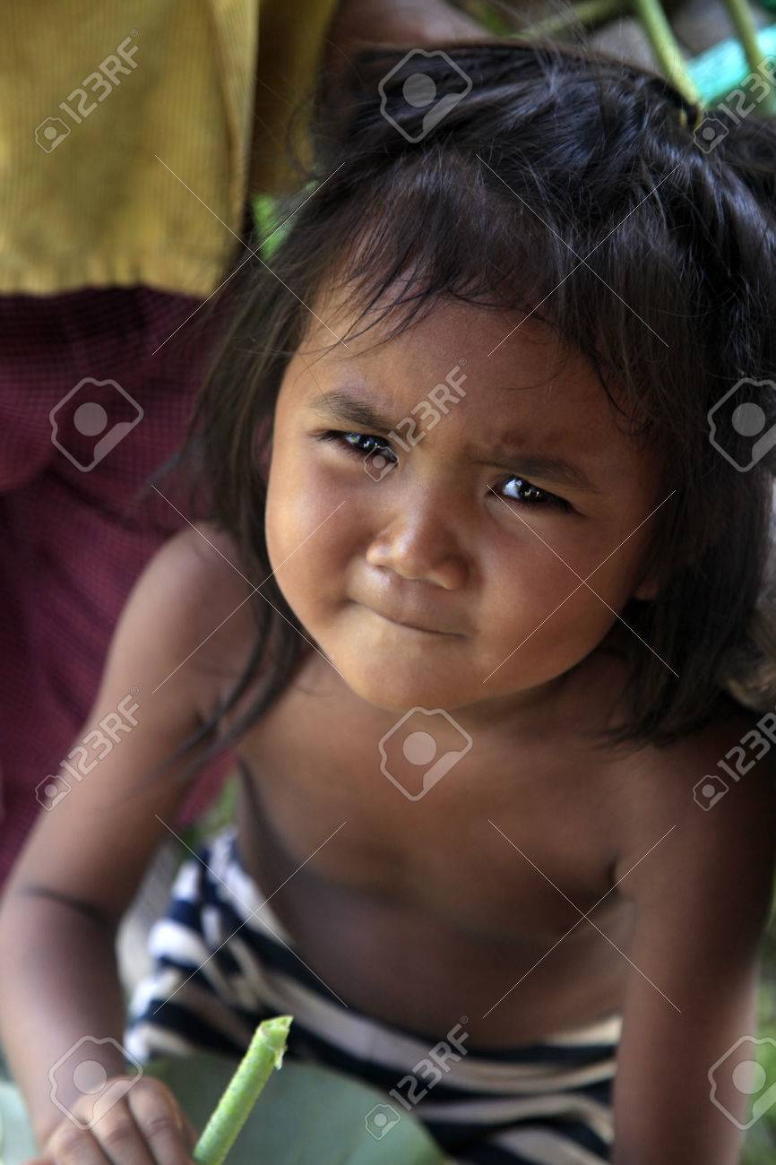 litte siem reap girl SIEM REAP, CAMBODIA - APRIL 06, 2014: Unknown Little Girl In A Poor Village In Siem Peap 6 April 2014, Cambodia Stock Photo, Picture and Royalty Free Image. Image 28305815.