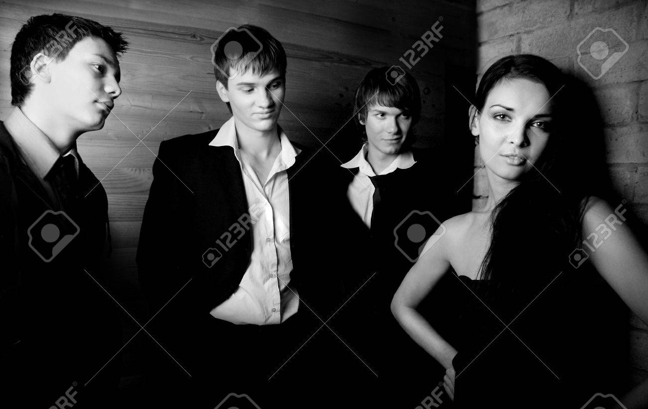 Stock Photo Three Stylish Guys And One Girl Stock Photo Three Stylish Guys And One Girl